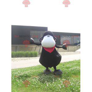 Mascotte de singe noir et blanc avec un foulard rouge -