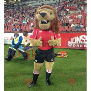 Mascota del león marrón rugiente en traje negro y rojo -