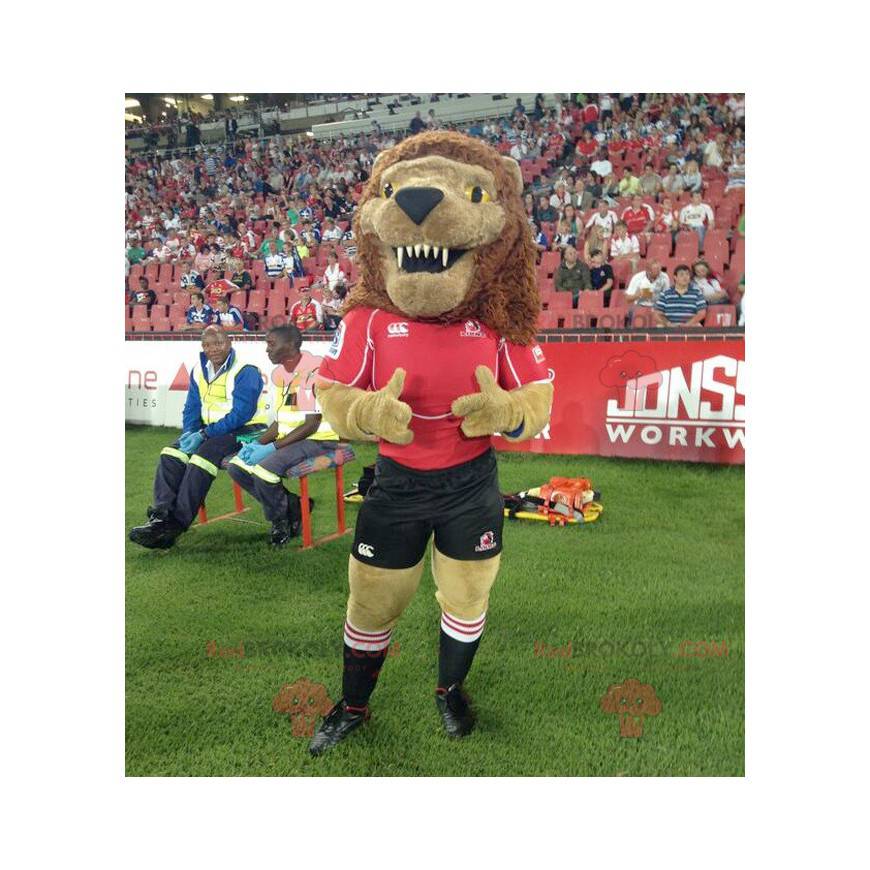 Roaring brown lion mascot in black and red outfit -