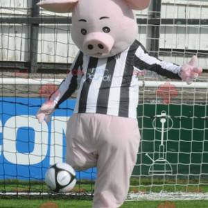 Mascota de cerdo rosa con un jersey blanco y negro -