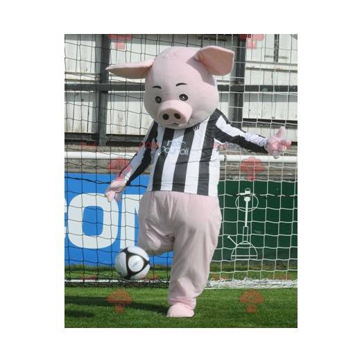 Mascota de cerdo rosa con un jersey blanco y negro -