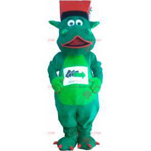 Zelený dinosaur maskot s kloboukem - Redbrokoly.com