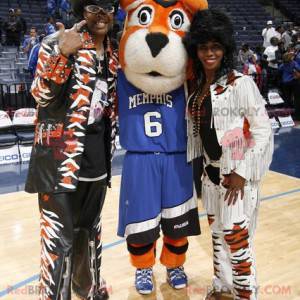 Orange white and black sport tiger mascot in blue outfit -