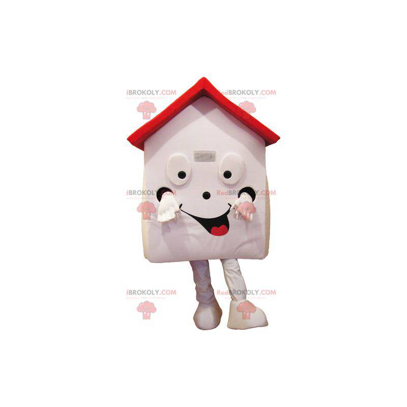 Mascotte de maison blanche et rouge très souriante -
