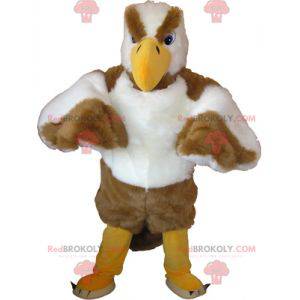 Mascot águila blanca y marrón mirando desagradable -