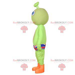Grünes außerirdisches Maskottchen mit einem britischen Slip -