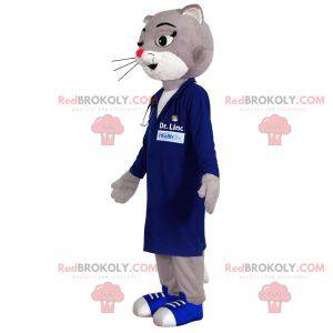 Mascotte de chat gris et blanc habillé d'une blouse bleue -