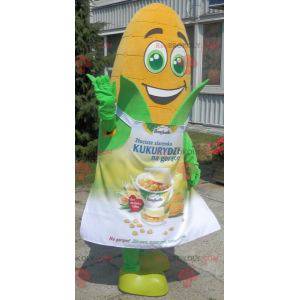 Giant corn ear mascot with green eyes and an apron -