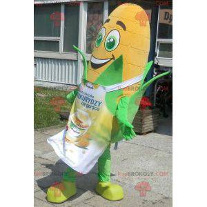 Giant corn ear mascot with green eyes and an apron -