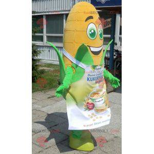 Giant corn ear mascot with green eyes and an apron -