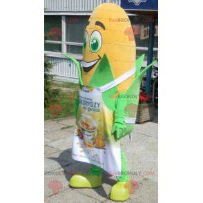 Giant corn ear mascot with green eyes and an apron -