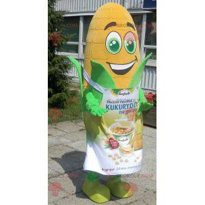 Giant corn ear mascot with green eyes and an apron -