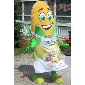 Giant corn ear mascot with green eyes and an apron -