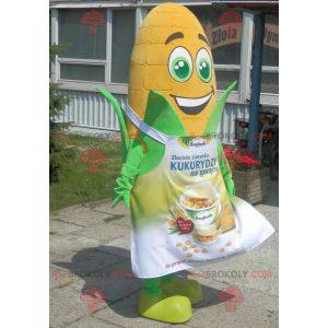 Giant corn ear mascot with green eyes and an apron -