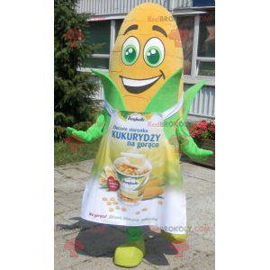 Giant corn ear mascot with green eyes and an apron -