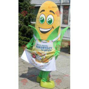 Giant corn ear mascot with green eyes and an apron -