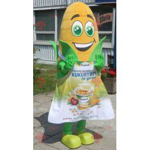 Giant corn ear mascot with green eyes and an apron -