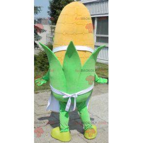 Giant corn ear mascot with green eyes and an apron -