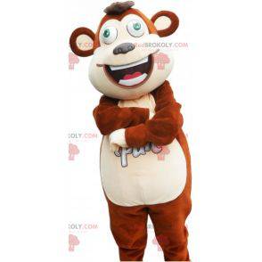 Mascotte de grand singe marron et blanc avec les yeux verts -