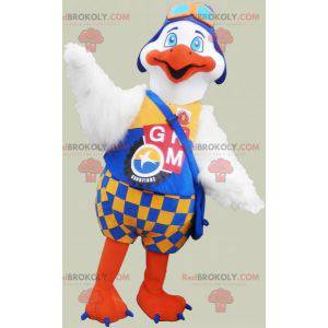 Mascot gran pájaro blanco y naranja con un traje colorido -