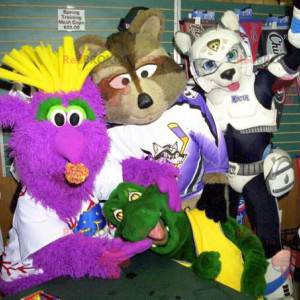 4 mascots a monster a raccoon a turtle and a dog -