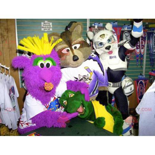 4 mascots a monster a raccoon a turtle and a dog -