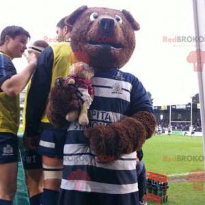 Mascotte dell'orso bruno in abbigliamento sportivo blu e bianco