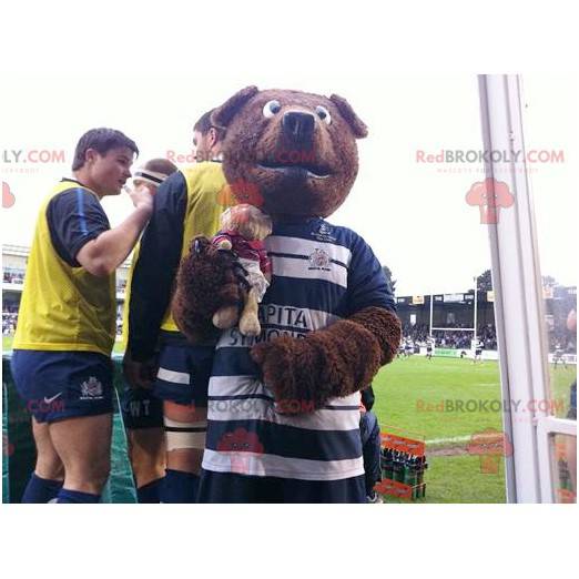 Brown bear mascot in blue and white sportswear - Redbrokoly.com