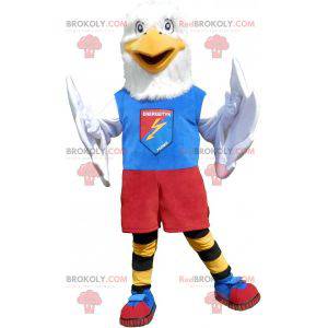 Mascota águila blanca en ropa deportiva colorida -