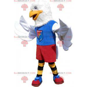 Mascote da águia branca em roupas esportivas coloridas -