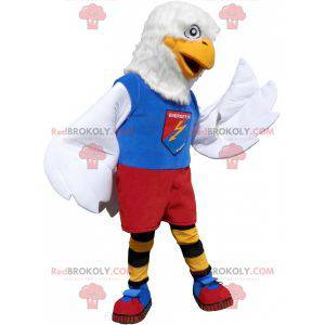 Mascota águila blanca en ropa deportiva colorida -
