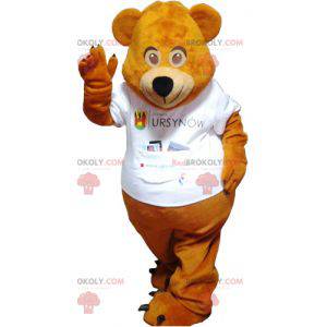 Mascotte de nounours marron avec un tee-shirt blanc -