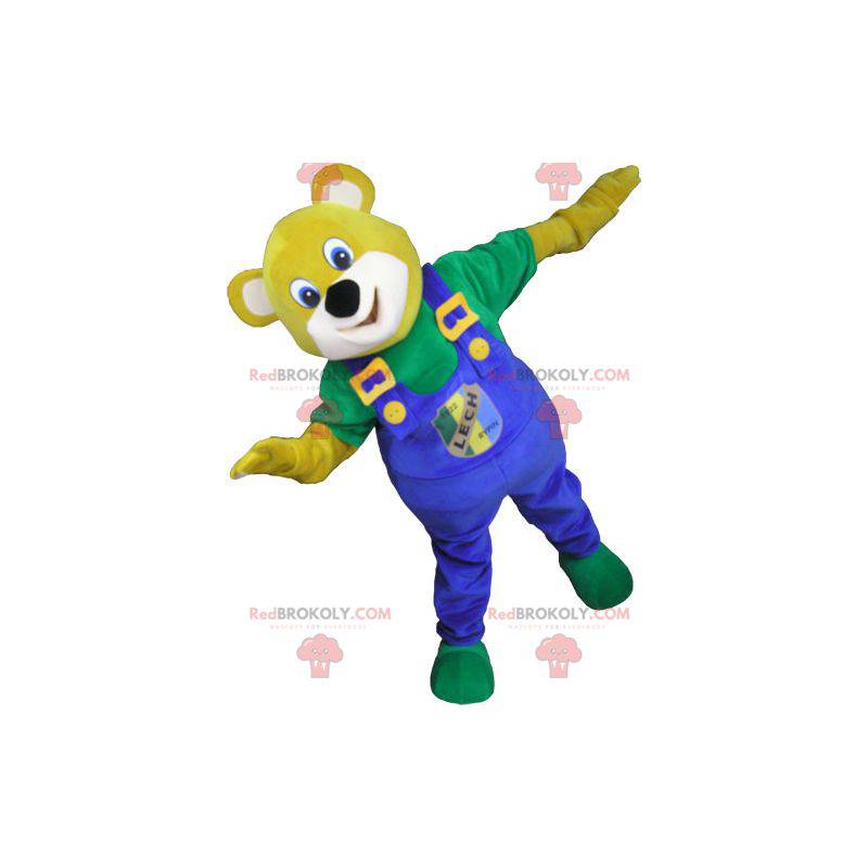 Mascote urso amarelo com macacão azul - Redbrokoly.com