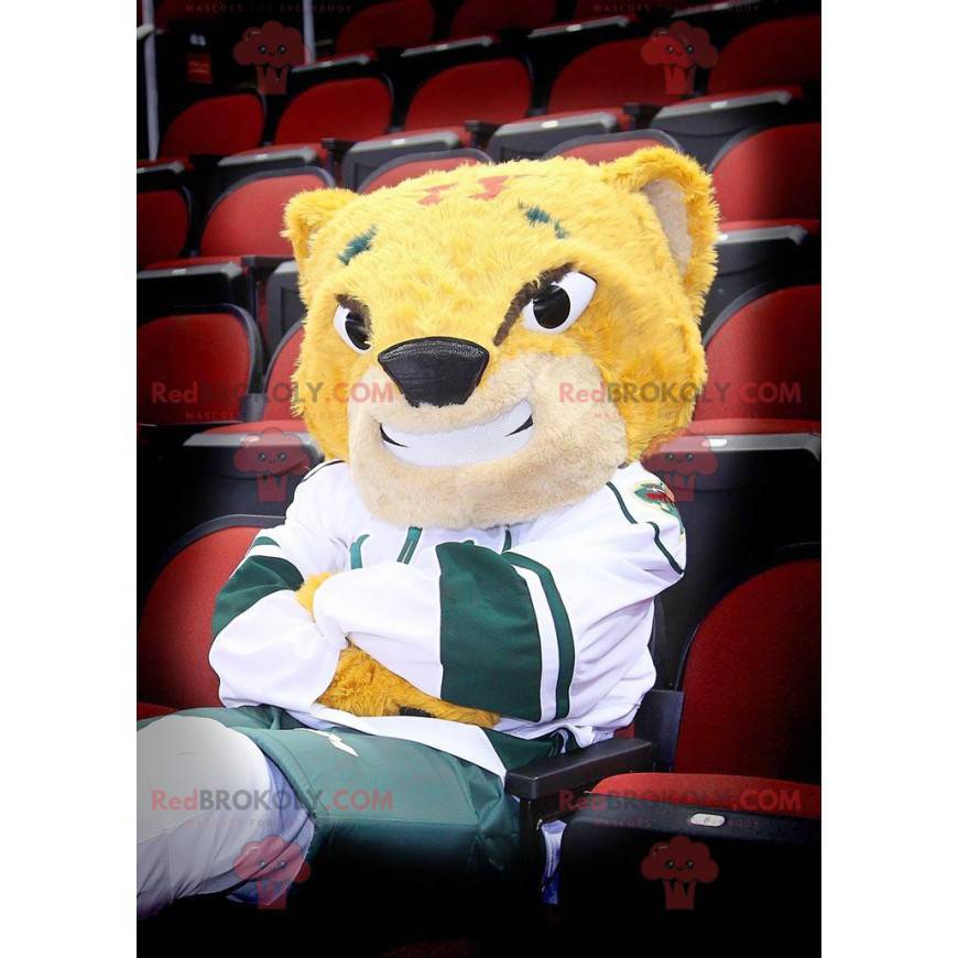 Mascote tigre amarelo sorrindo em roupas esportivas -