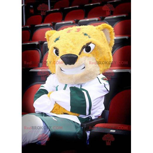 Mascote tigre amarelo sorrindo em roupas esportivas -