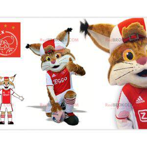 Brown and white lynx mascot in footballer outfit -