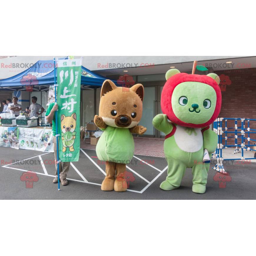 2 mascotes, uma raposa marrom e um urso verde com uma maçã -