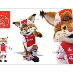 Brown and white lynx mascot in footballer outfit -