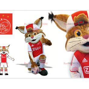 Mascotte lince marrone e bianca in abito da calciatore -