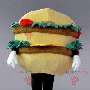 Mascot hamburguesa gigante de color beige y marrón con ensalada