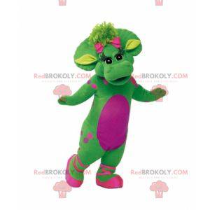 Mascotte de dinosaure vert et rose géant et élégant -