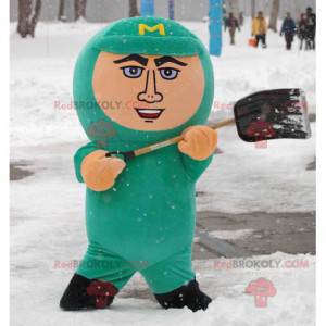 Mascotte d'homme avec une combinaison et une cagoule verte -