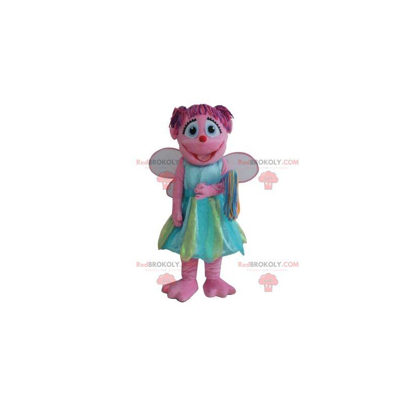 Smiling pink fairy mascot with a colorful dress - Redbrokoly.com