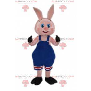 Pig mascot in wrestling outfit in blue overalls - Redbrokoly.com