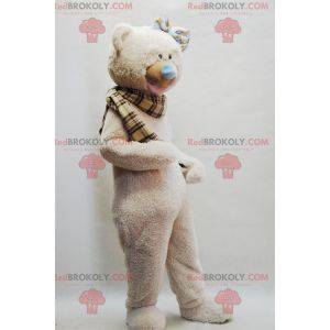 Beige mascotte orsacchiotto con una sciarpa scozzese -