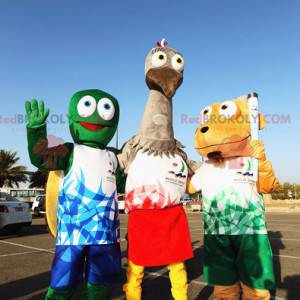 3 mascotes, uma tartaruga verde, uma avestruz cinza e um