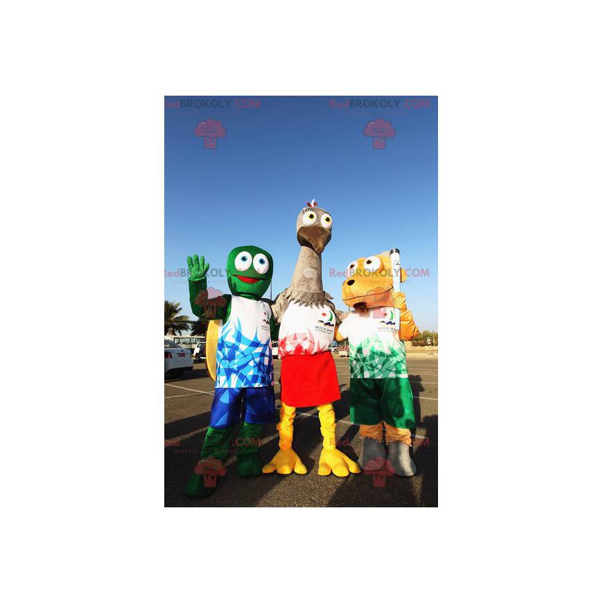 3 mascotes, uma tartaruga verde, uma avestruz cinza e um