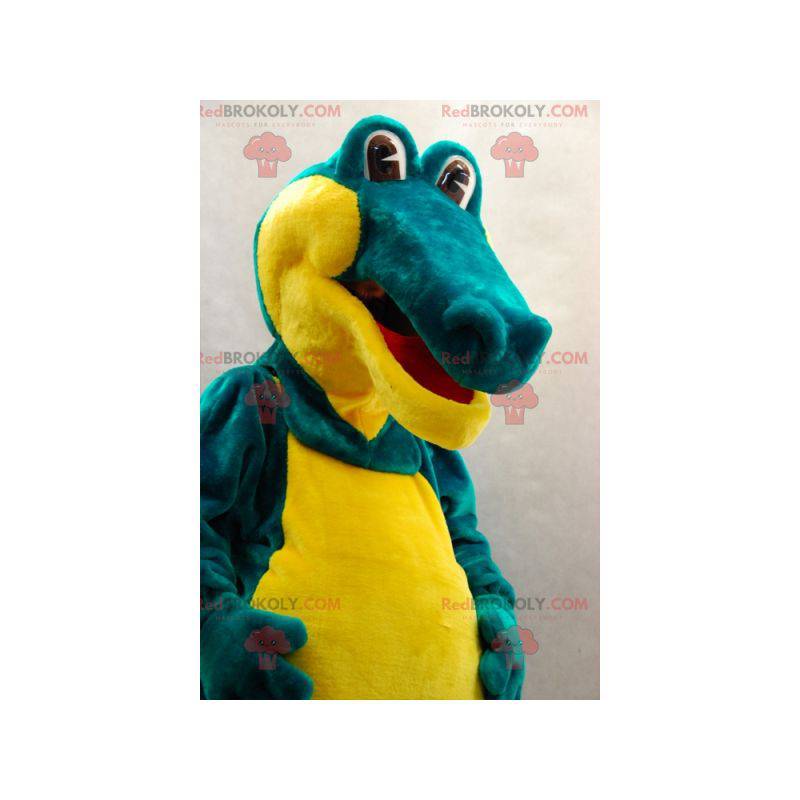 Mascote crocodilo verde e amarelo suave e divertido -