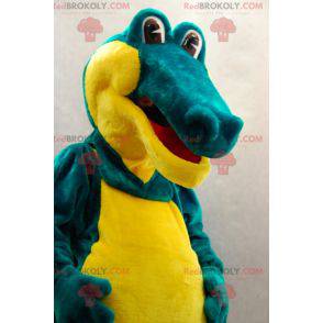 Mascote crocodilo verde e amarelo suave e divertido -