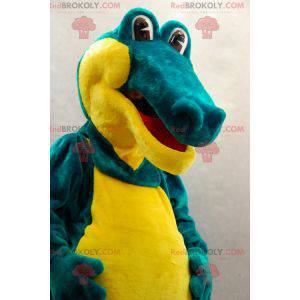 Mascote crocodilo verde e amarelo suave e divertido -
